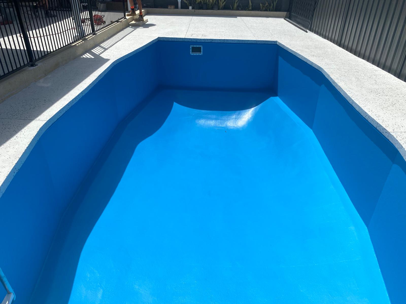 Restored blue fibreglass pool with a fresh finish